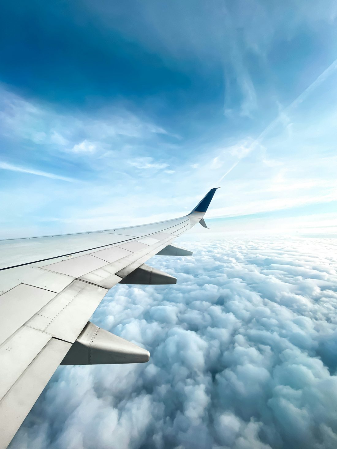 Airplane wing above the clouds